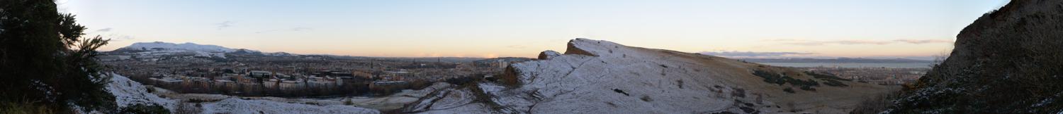 Edinburgh panorama view from halfway up Arthur's Seat looking over the wintery Crags.